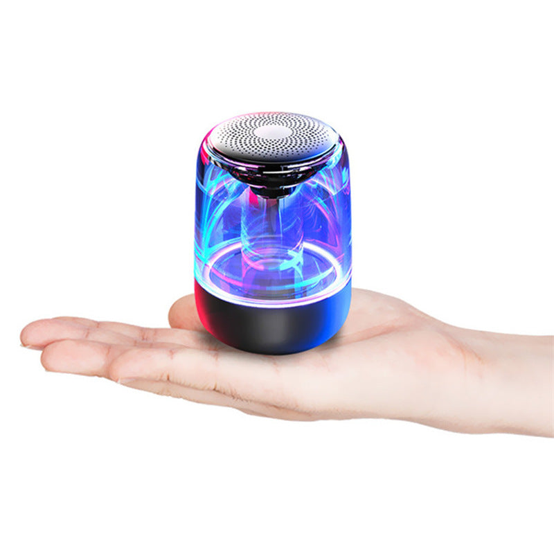 Electronic speaker in the palm of a person's hand